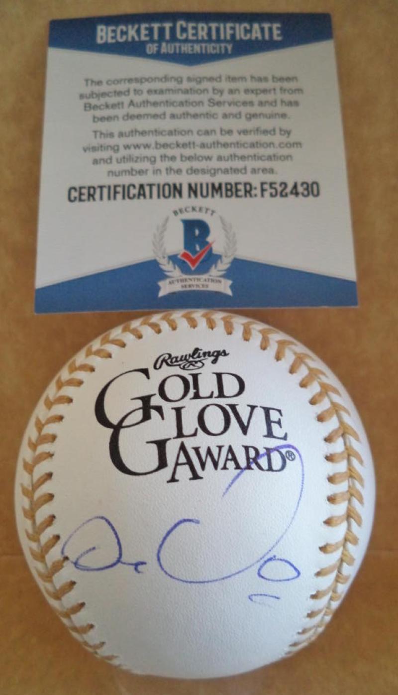 CARLOS GONZALEZ ROCKIES SIGNED UNER GOLD GLOVE AWARD BASEBALL BECKETT F52430