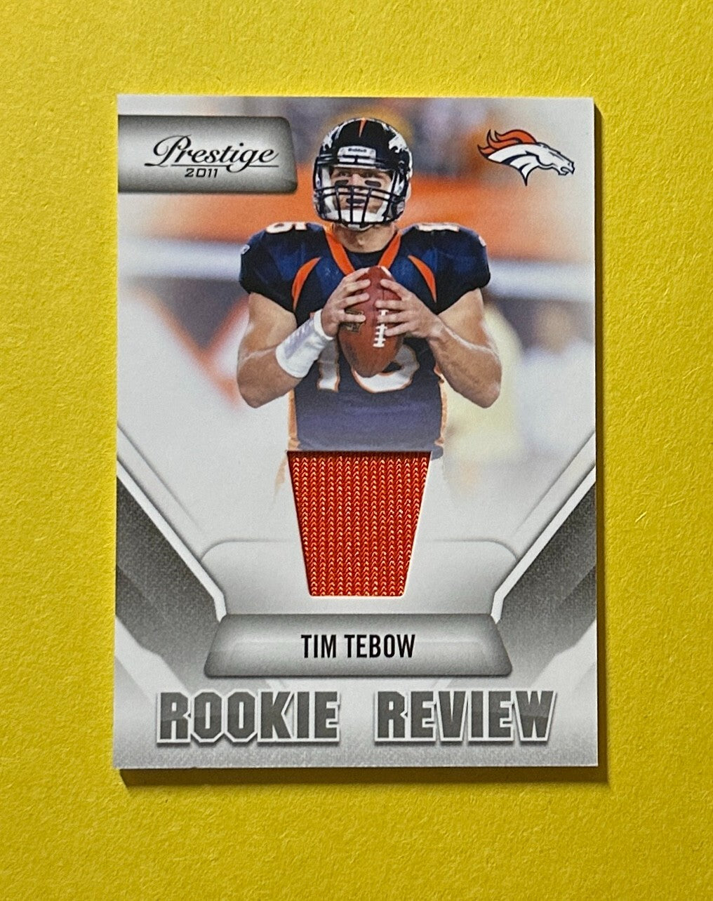 2011 PANINI PRESTIGE TIM TEBOW ROOKIE RELIC #38 BRONCOS