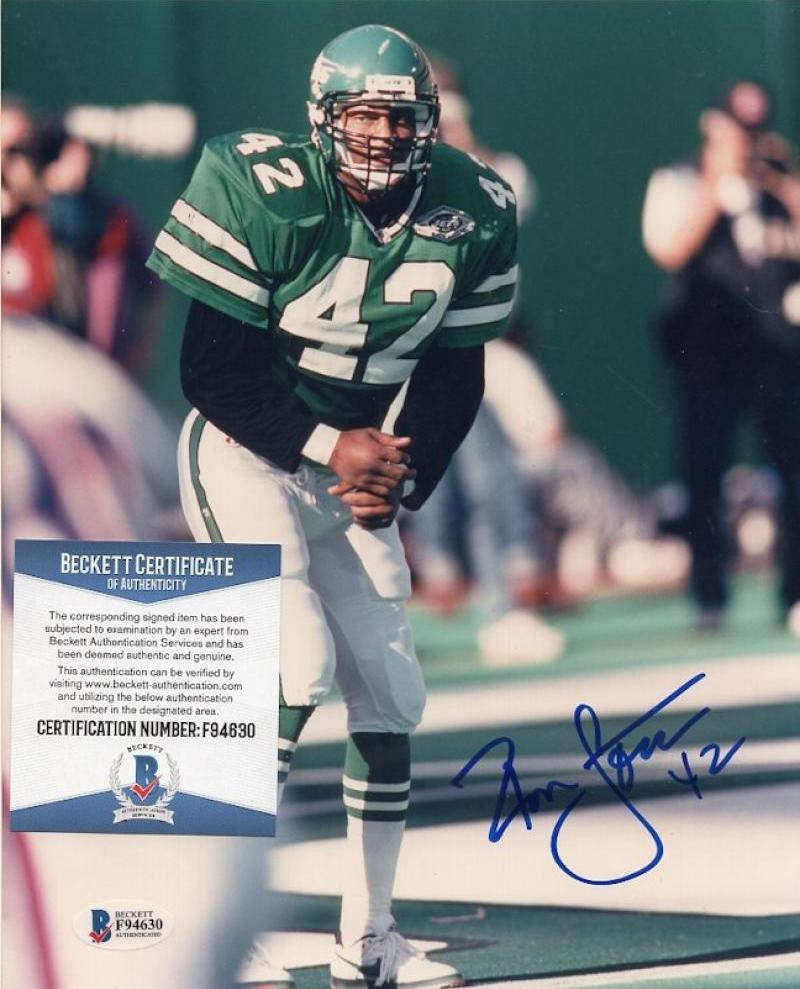RONNIE LOTT NEW YORK JETS SIGNED AUTOGRAPHED 8X10 PHOTO BECKETT AUTH F94630
